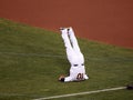 Oakland AÃ¢â¬â¢s Pitcher Daric Barton does at Shoulder stand yoga pose Royalty Free Stock Photo